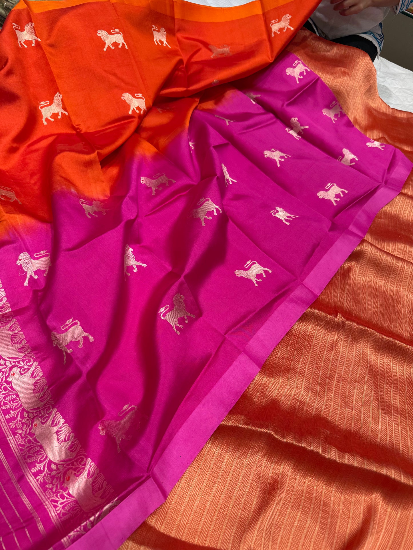 Handwoven orange georgette tissue kurta paired with chinniya silk shaded lion motifs dupatta