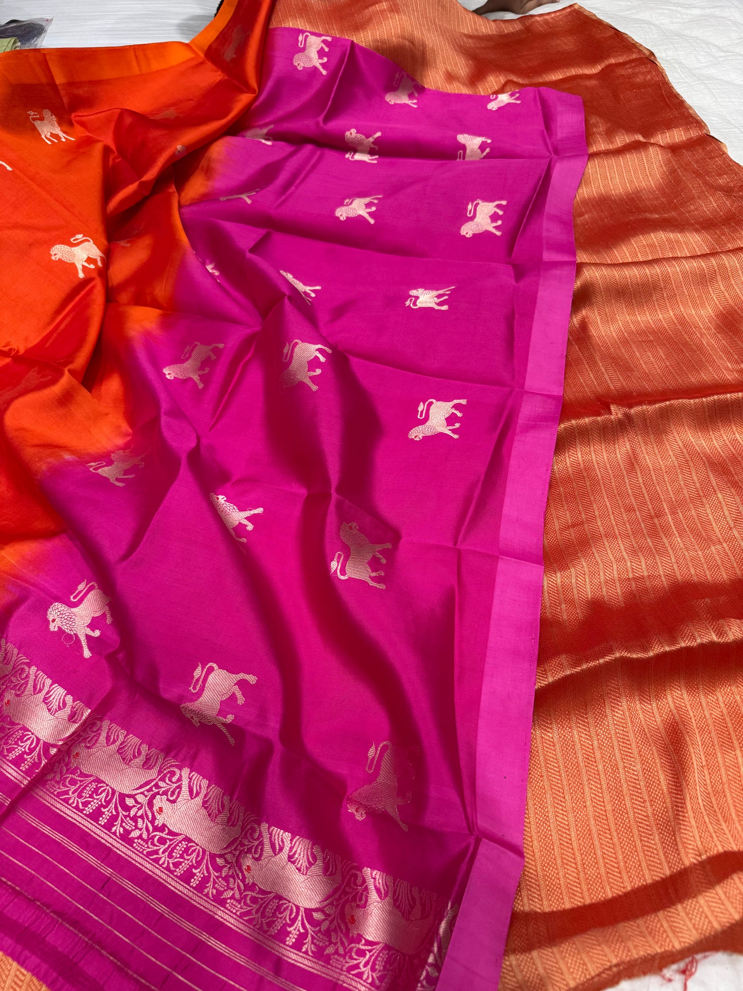 Handwoven orange georgette tissue kurta paired with chinniya silk shaded lion motifs dupatta