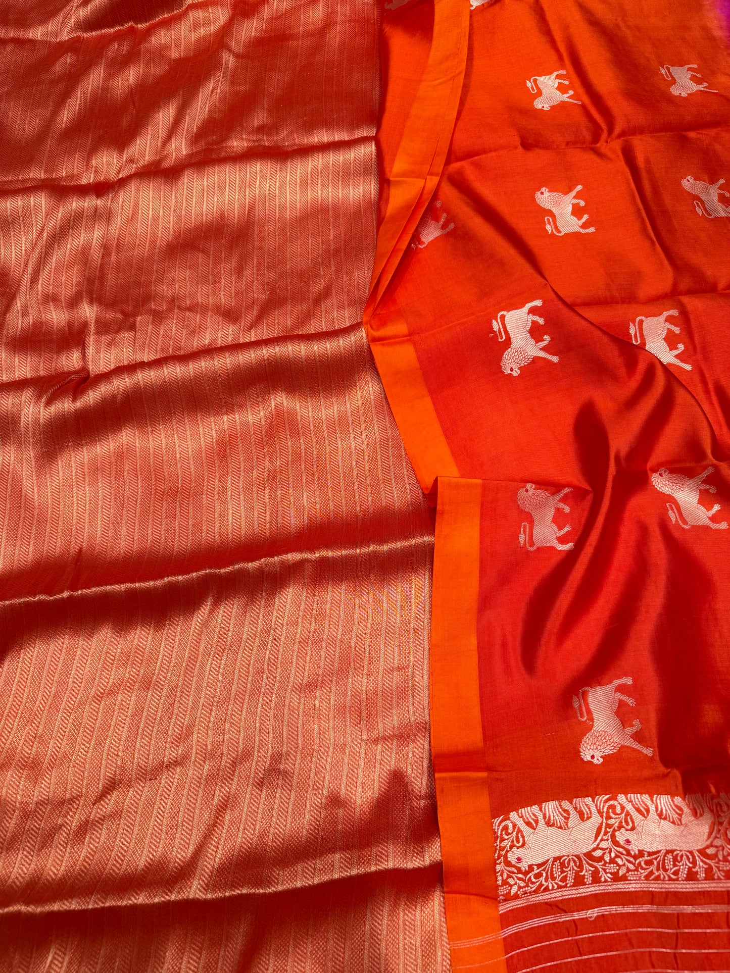Handwoven orange georgette tissue kurta paired with chinniya silk shaded lion motifs dupatta