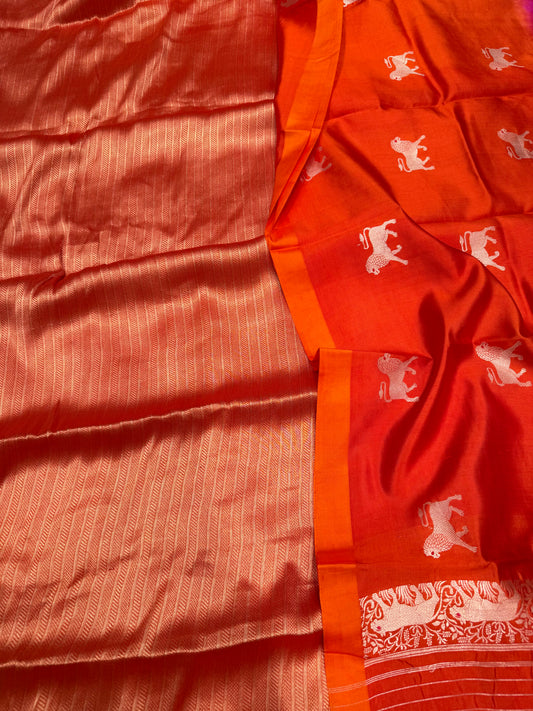 Handwoven orange georgette tissue kurta paired with chinniya silk shaded lion motifs dupatta