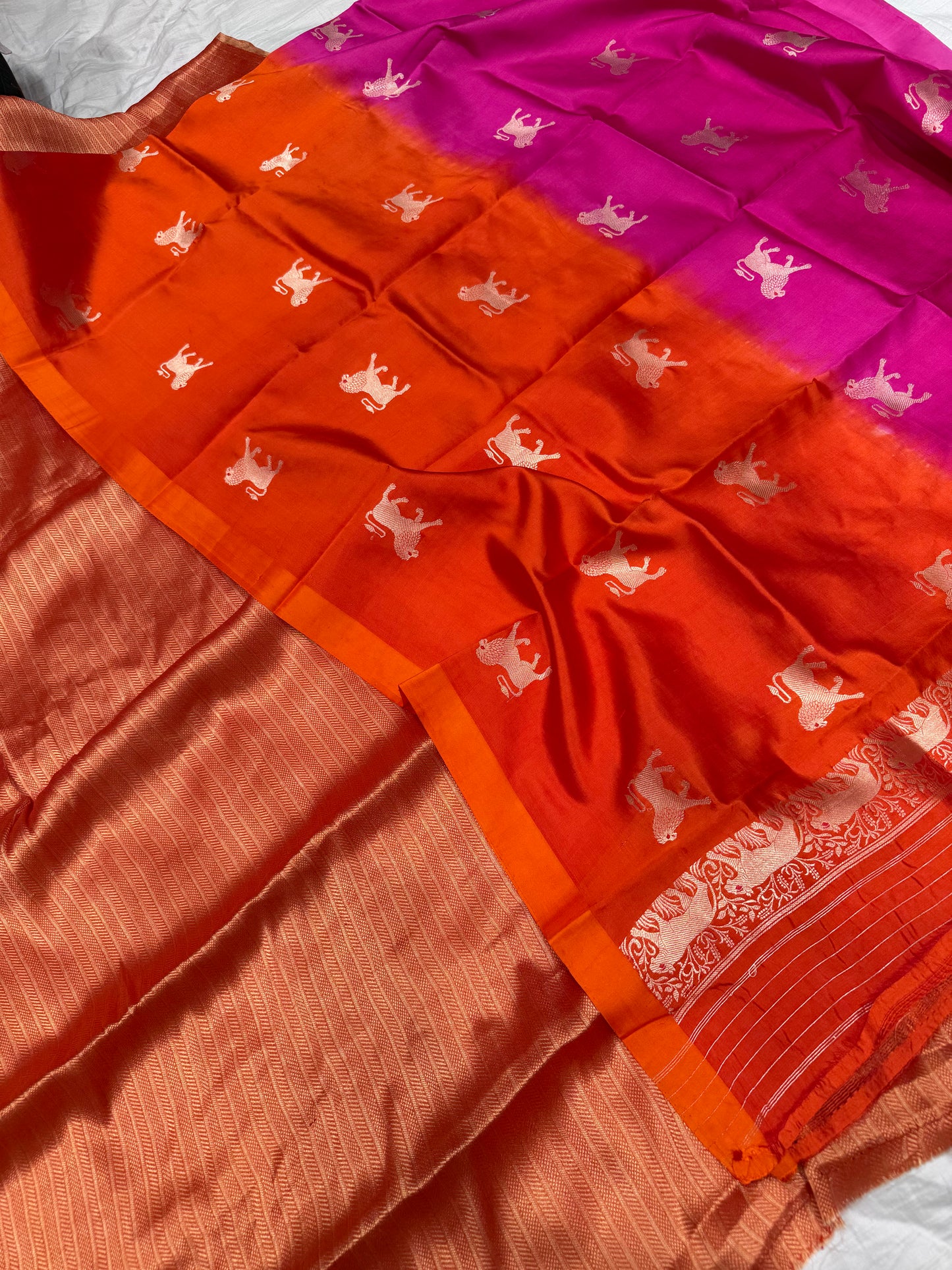 Handwoven orange georgette tissue kurta paired with chinniya silk shaded lion motifs dupatta