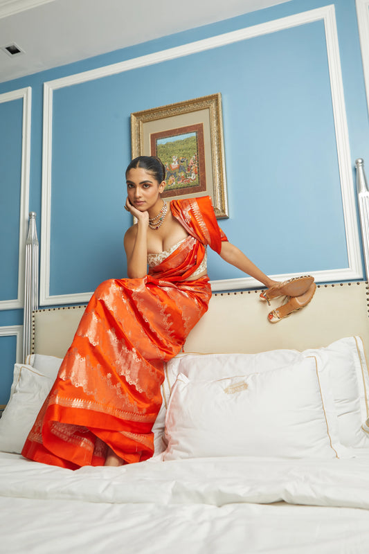 Handwoven Orange Soft Silk Saree With Aari Design Adorned With Red Meenakari